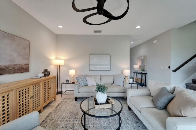living room featuring recessed lighting, stairs, visible vents, and a ceiling fan