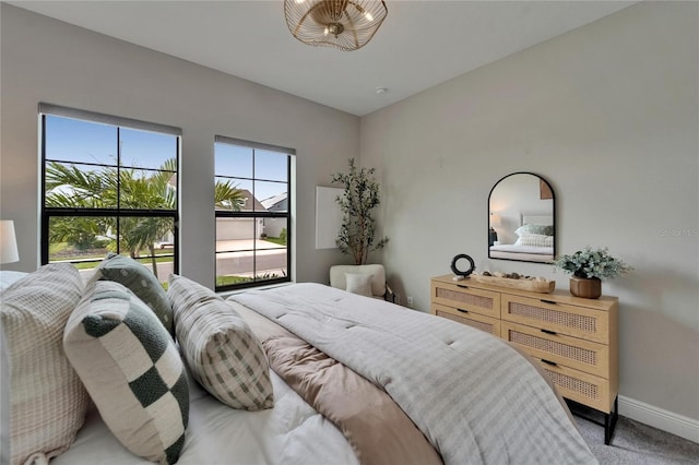carpeted bedroom with baseboards