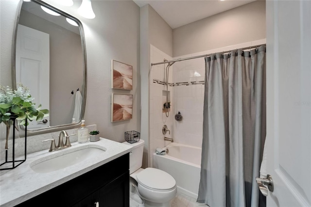 full bath with toilet, shower / bath combo with shower curtain, and vanity