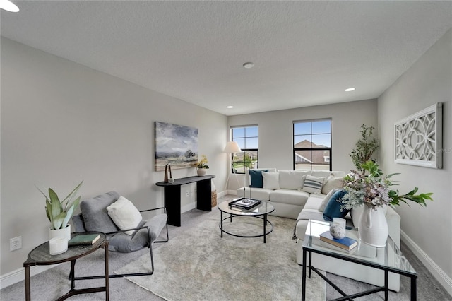living room featuring recessed lighting, baseboards, and carpet floors