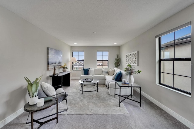 living area with recessed lighting, carpet, and baseboards