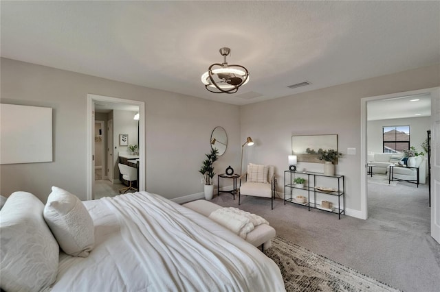 carpeted bedroom featuring a chandelier, visible vents, and baseboards