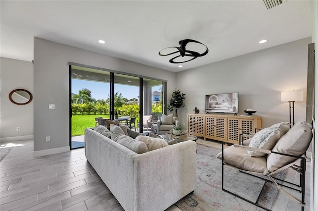 5601 Limelight Dr, Apollo Beach, FL 33572 - living room with a ceiling fan, light wood finished floors, and recessed lighting