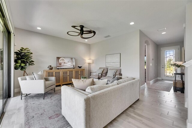 5601 Limelight Dr, Apollo Beach, FL 33572 - living room with a ceiling fan, recessed lighting, and light wood-type flooring