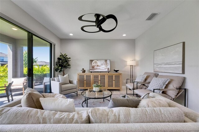 5601 Limelight Dr, Apollo Beach, FL 33572 - living room featuring a ceiling fan and recessed lighting