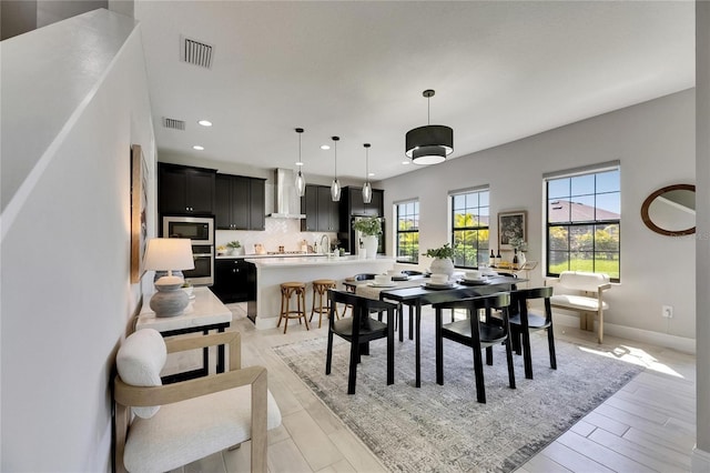5601 Limelight Dr, Apollo Beach, FL 33572 - dining room featuring recessed lighting and light wood-style flooring