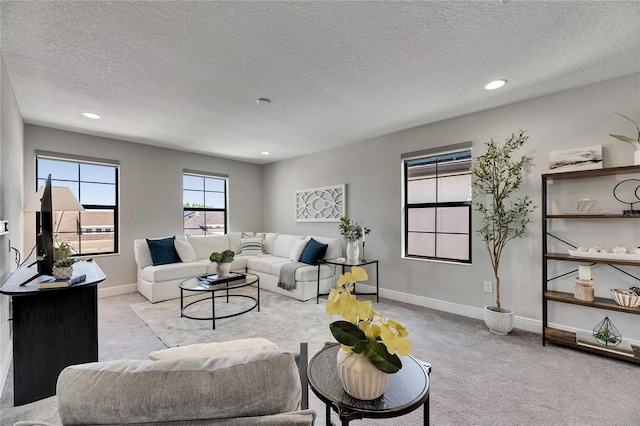 5601 Limelight Dr, Apollo Beach, FL 33572 - carpeted living area featuring a textured ceiling and recessed lighting