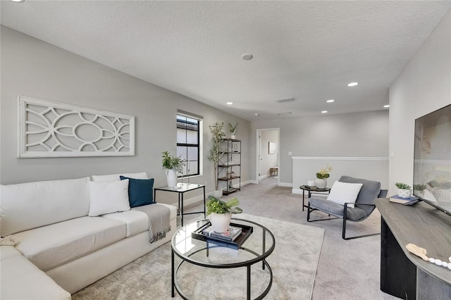 5601 Limelight Dr, Apollo Beach, FL 33572 - living room featuring carpet flooring, recessed lighting, and a textured ceiling