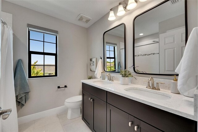 5601 Limelight Dr, Apollo Beach, FL 33572 - bathroom featuring double vanity, tile patterned flooring, and tiled shower