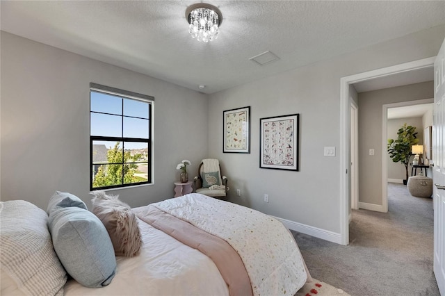 5601 Limelight Dr, Apollo Beach, FL 33572 - carpeted bedroom featuring baseboards and a textured ceiling