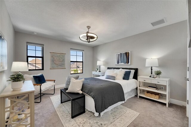 5601 Limelight Dr, Apollo Beach, FL 33572 - bedroom with light colored carpet and a textured ceiling