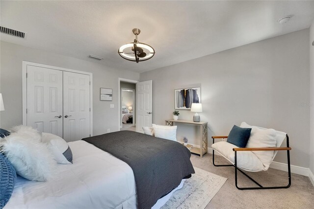 5601 Limelight Dr, Apollo Beach, FL 33572 - bedroom featuring a closet and light colored carpet