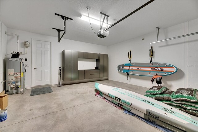 5601 Limelight Dr, Apollo Beach, FL 33572 - garage with water heater and a garage door opener