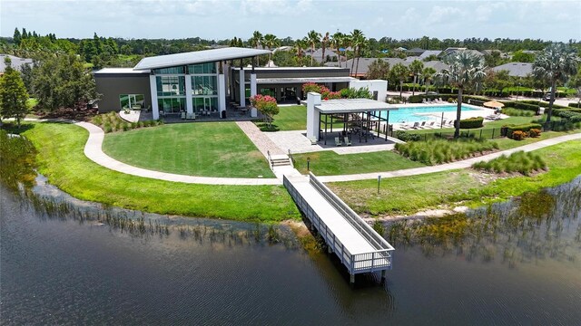5601 Limelight Dr, Apollo Beach, FL 33572 - rear view of property featuring a water view, a yard, and a patio