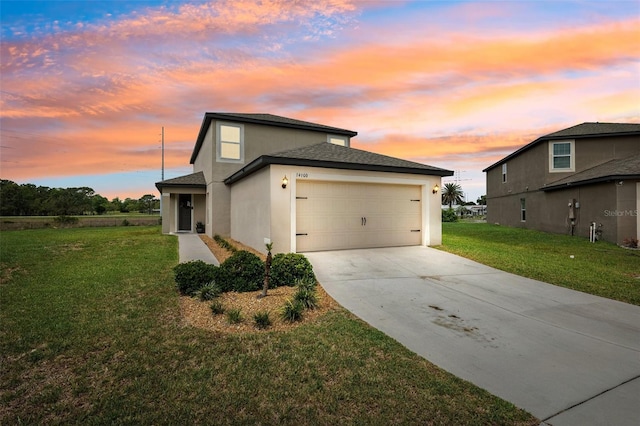 14100 Holly Hammock Ln, Brooksville, FL 34613 - property exterior at dusk with concrete driveway, an attached garage, stucco siding, and a lawn