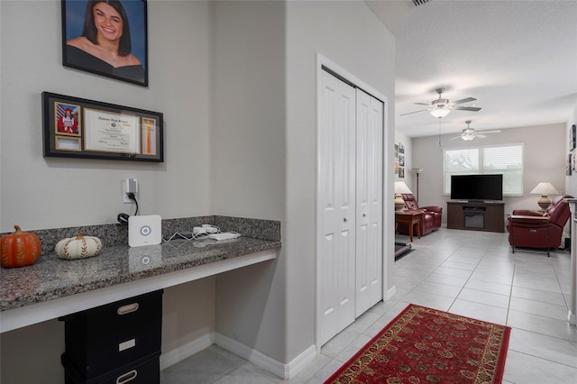 11704 Castine St, New Port Richey, FL 34654 - bathroom with a closet, baseboards, tile patterned flooring, and a ceiling fan