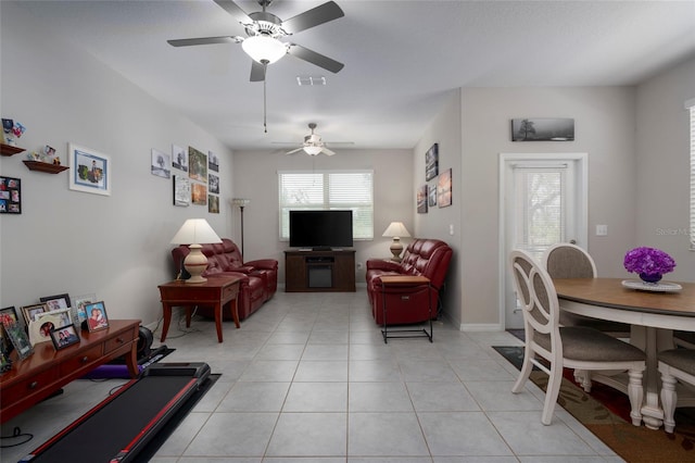 11704 Castine St, New Port Richey, FL 34654 - living area featuring light tile patterned floors, visible vents, and ceiling fan