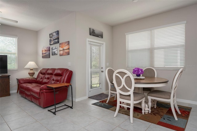 11704 Castine St, New Port Richey, FL 34654 - dining area with light tile patterned floors and baseboards