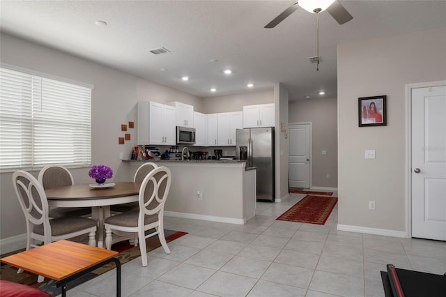 11704 Castine St, New Port Richey, FL 34654 - kitchen featuring a ceiling fan, recessed lighting, visible vents, a peninsula, and appliances with stainless steel finishes