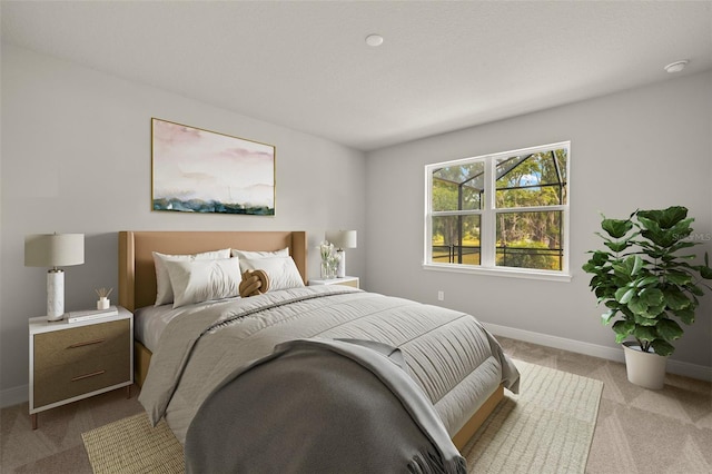 bedroom featuring baseboards and light carpet