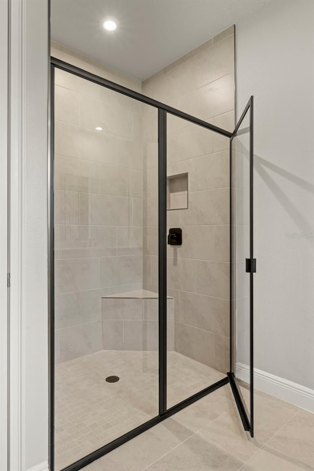 full bathroom with recessed lighting, baseboards, a stall shower, and tile patterned floors