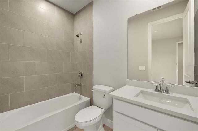 bathroom with toilet, visible vents, bathing tub / shower combination, and vanity