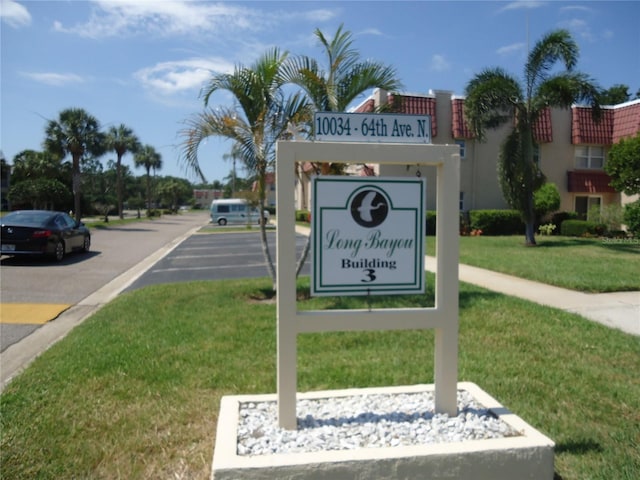 10034 64th Ave N Unit 21, Saint Petersburg, FL 33708 - community sign featuring a lawn