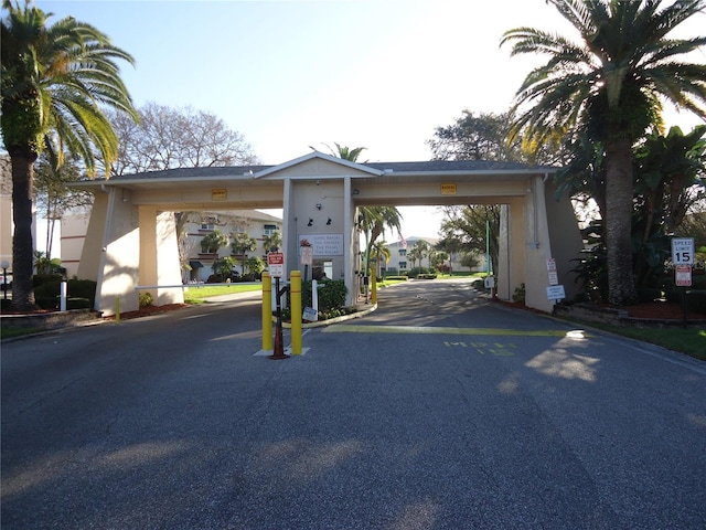10034 64th Ave N Unit 21, Saint Petersburg, FL 33708 - view of road with curbs and a gated entry