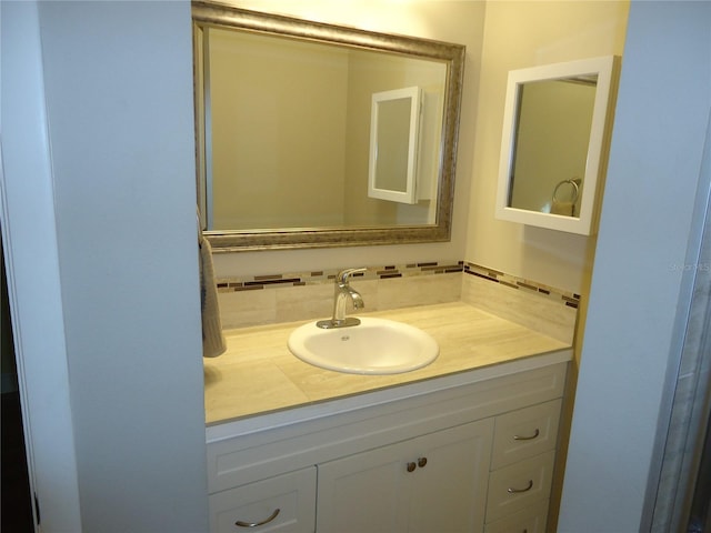10034 64th Ave N Unit 21, Saint Petersburg, FL 33708 - bathroom with tasteful backsplash and vanity