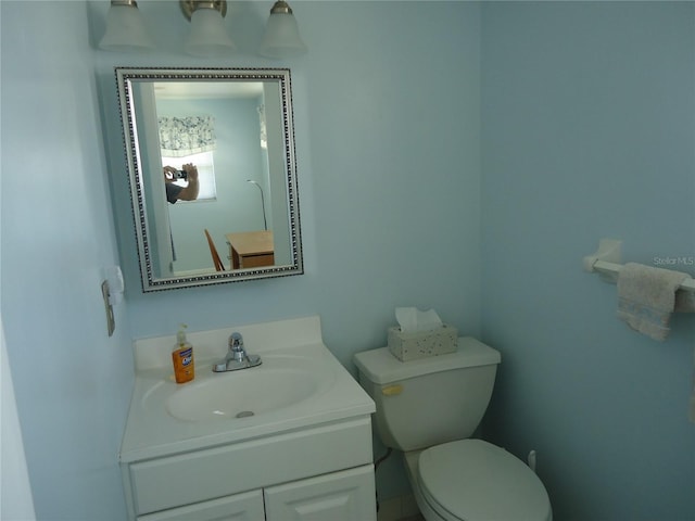10034 64th Ave N Unit 21, Saint Petersburg, FL 33708 - half bathroom featuring toilet and vanity