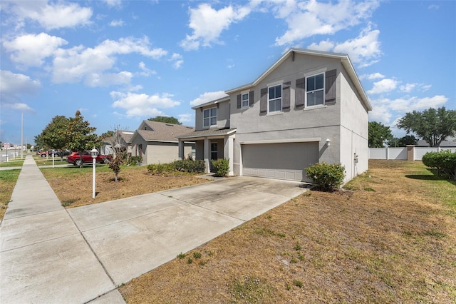 5597 Forest Ridge Dr, Winter Haven, FL 33881 - traditional home featuring a garage, concrete driveway, stucco siding, and fence