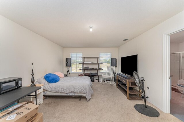 5597 Forest Ridge Dr, Winter Haven, FL 33881 - bedroom with light carpet