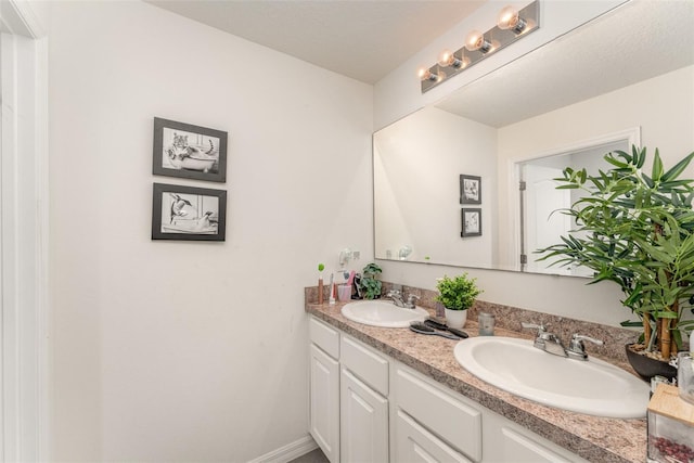 5597 Forest Ridge Dr, Winter Haven, FL 33881 - bathroom with double vanity and baseboards