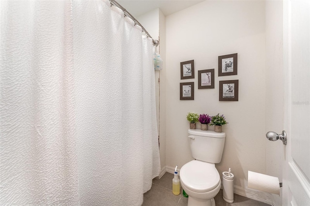 5597 Forest Ridge Dr, Winter Haven, FL 33881 - bathroom featuring tile patterned floors, toilet, and baseboards