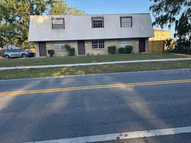 6635 Congress St, New Port Richey, FL 34653 - view of front of home featuring a front yard and fence