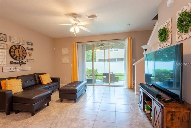 10425 Yellow Spice Ct, Riverview, FL 33578 - living room with ceiling fan, visible vents, and light tile patterned floors