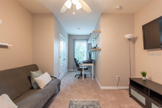 10425 Yellow Spice Ct, Riverview, FL 33578 - home office with ceiling fan, light colored carpet, and baseboards