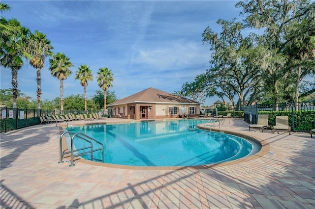 10425 Yellow Spice Ct, Riverview, FL 33578 - community pool with a patio area, an outdoor structure, and fence