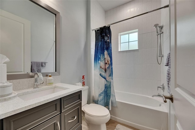 bathroom featuring vanity, toilet, and shower / bath combination with curtain