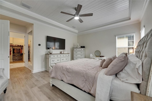 bedroom featuring visible vents, crown molding, wooden ceiling, a raised ceiling, and light wood finished floors