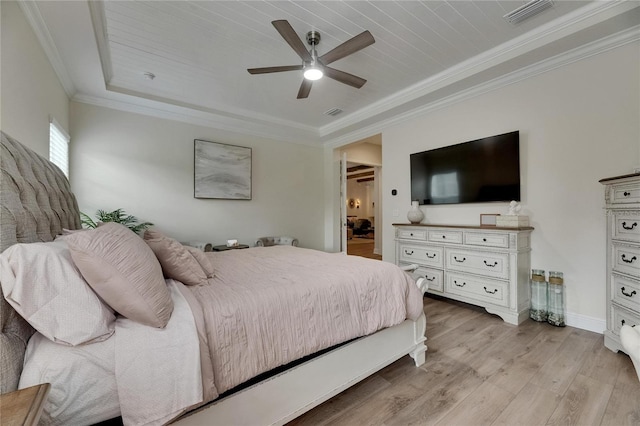 bedroom featuring ceiling fan, baseboards, light wood-type flooring, visible vents, and ornamental molding