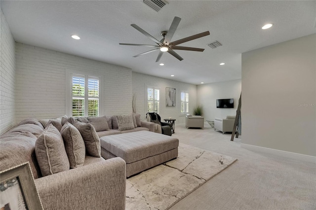 living room featuring visible vents, a ceiling fan, and recessed lighting