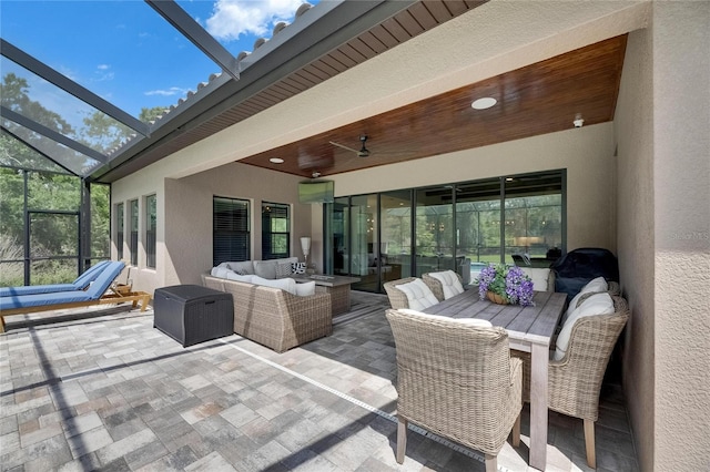 view of patio featuring a ceiling fan, a lanai, and an outdoor hangout area