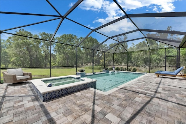 view of pool with glass enclosure, a patio area, and a pool with connected hot tub