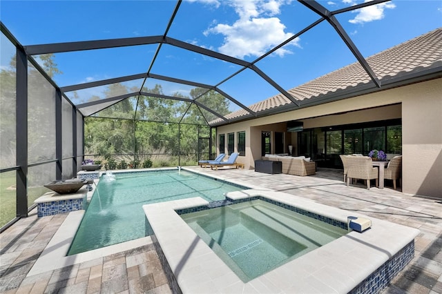 view of pool featuring outdoor lounge area, a patio area, and a pool with connected hot tub