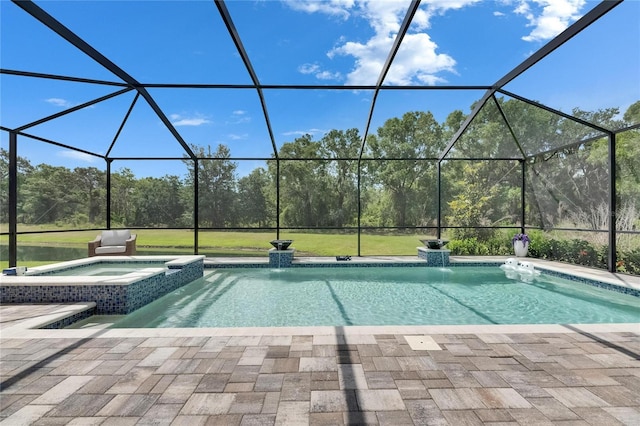 view of swimming pool with glass enclosure, a pool with connected hot tub, and a patio area
