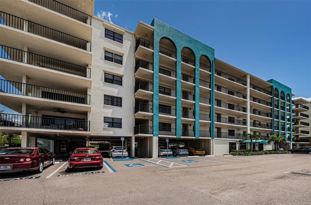 view of property with uncovered parking