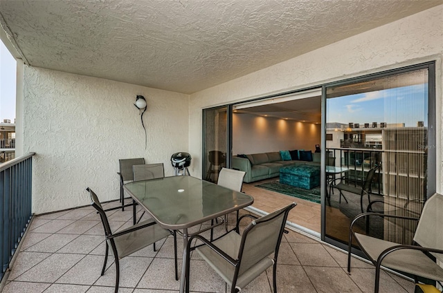 balcony featuring outdoor dining area