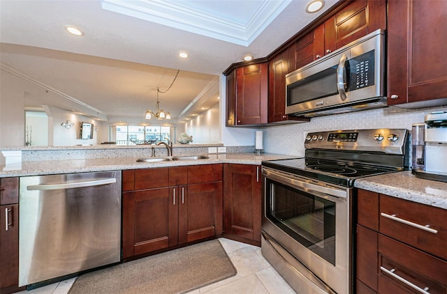 kitchen with tasteful backsplash, a sink, ornamental molding, stainless steel appliances, and light stone counters