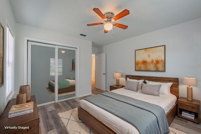 701 W Idlewild Ave, Tampa, FL 33604 - bedroom with wood finished floors, a closet, ceiling fan, baseboards, and visible vents